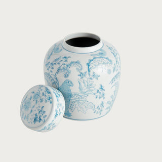 Small blue and white ceramic ginger jar with parrot and botanical pattern and classic lidded silhouette