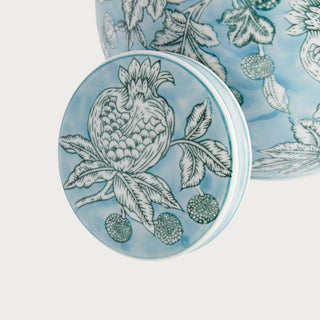 Small blue ceramic ginger jar with pomegranate sketch pattern and classic rounded lidded silhouette