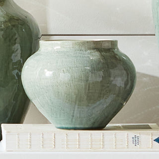 Styled Matte white ceramic Butera pot with crosshatch texture, handcrafted with a matte finish. Perfect for faux florals or as a sculptural accent on shelves or tables.
