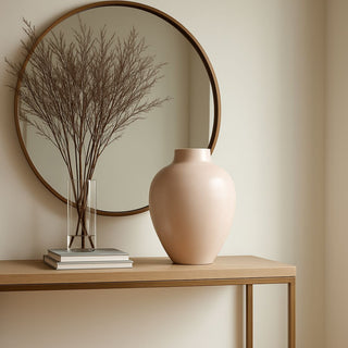 Styled in a beautiful contemporary decor style entryway, 16.75" High Light Blush/ecru handcrafted ceramic vase