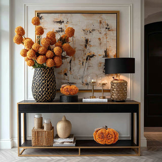 Styled 7.5" orange shaved wood pumpkin on modern contemporary decor style console table with other fall home decor items