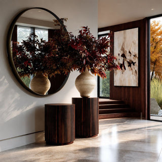 Third & Main 60-inch Earthen Composition rust hand-painted abstract canvas displayed in a modern luxury entryway with burgundy fall foliage and dark wood accents.