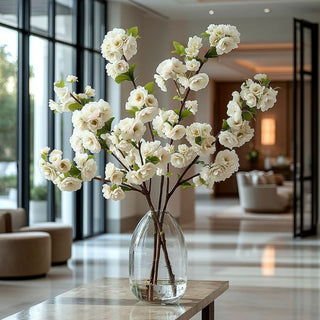 Styled in a beautiful vase on an elegant table, 41" True Bloom Real Touch Creamy White Blossom Branch Stem 