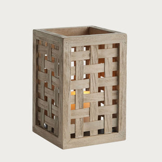 Natural teak outdoor hurricane lantern with woven design detail. Perfect for patios, outdoor dining, and warm ambient LED candle styling.