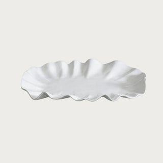 large white bloom serving platter with sculptural petal edges styled on dining table for charcuterie and entertaining