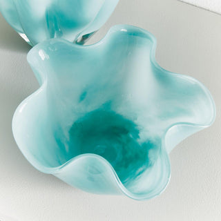 A modern update to the open glass form, the mouth blown organic bowl is made with pot color, not sprayed. A soft light blue watercolor-inspired look.
Dimensions: 7.5 x 7.5 x 5
Material: Glass, Color: Light Blue, Care & Use: Interior use. Handwash glass. Avoid detergents or chemicals that might be harmful to finish.
Third & Main, Home Decor, Spring Decor, Decor, Everyday Decor, Glass, Blue, Handmade, 
