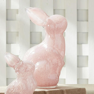The hand blown and molded glass bunny sculpture is simply adorable in Spring or even year round. The color is added to glass during heat process, not sprayed. A classic design in a pastel pink. A cheerful touch of color to adorn your side table, coffee table or ottoman. Please select your size
Details: Dimensions: Large:&nbsp;3.5 x 3 x 4, Small: 2.5 x 2 x 4.5 Material: Glass
Care &amp; Use: Interior use. Dust with soft cloth. Do not clean with harsh chemicals. Third & Main, Home Decor, Spring Decor, Modern
