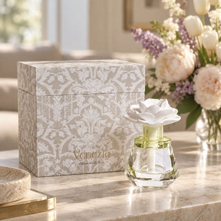 Isabella diffuser and gift box on a table with pastel flowers