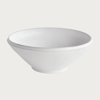 This hand-thrown terracotta bowl is finished with a warm white glaze and has soft visible throw lines which only add to its character. Well-scaled for a stunning tabletop moment, add some colorful orbs or simply beautiful displayed as is.
Details: Dimensions: 18.75 x 18.75 x 7.25 Material: Terracotta, Care & Use: Handcrafted by skilled artisans, each piece is an original and varies in size and color. Dust with dry cloth. Protect fine furniture by lining the interior of the pottery when necessary. Third&Main