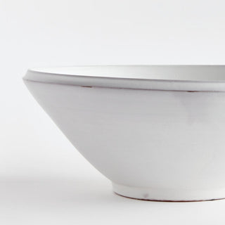 This hand-thrown terracotta bowl is finished with a warm white glaze and has soft visible throw lines which only add to its character. Well-scaled for a stunning tabletop moment, add some colorful orbs or simply beautiful displayed as is.
Details: Dimensions: 18.75 x 18.75 x 7.25 Material: Terracotta, Care & Use: Handcrafted by skilled artisans, each piece is an original and varies in size and color. Dust with dry cloth. Protect fine furniture by lining the interior of the pottery when necessary. Third&Main