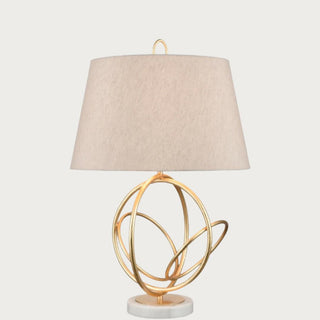 The Moreley Lamp, features gracefully intertwined hoops, creating a harmonious balance of structure and simplicity. Third & Main, Home Decor, Lighting, Table Lighting, Contemporary Lighting