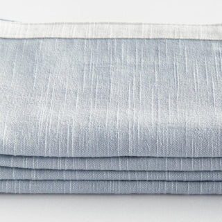 Bring a touch of softness to the table with this set of four 100% woven cotton napkins. Beautiful in tone and texture, the white &amp; blue combination is made to add a pop of color to any tablescape.
Details:
Dimensions: 18"x18", Color: Blue/White, Material: Cotton, Set of Four Napkins, Care & Use: Machine wash cold with like colors, gentle cycle. Do not bleach. Line dry. Warm iron. Do not dry clean.
Third & Main, Home Decor, Textiles, Kitchen, Hostess, Modern Farmhouse, Modern Traditional, White trim