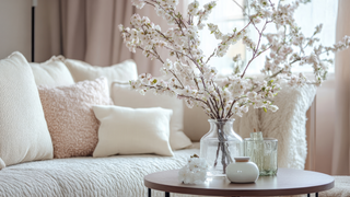 This is a photo of a neutral color living room in soft ivory and pink colors, there is a pretty floral arrangement on the coffee table, Spring Decor Shop, Third & Main
