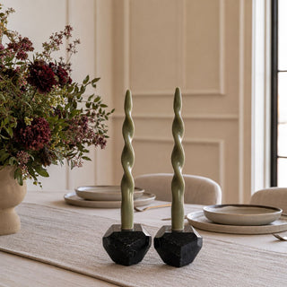 4 inch Trinity Black Marble Taper Candle Holder styled with olive taper candles on a dining table with layered florals and neutral tableware.