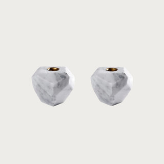 Pair of 4 Inch Trinity White Marble Taper Candle Holders with faceted marble bases, brass-tone taper openings, and natural gray veining for contemporary tabletop styling.