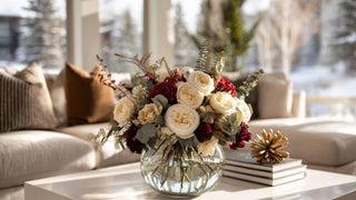 bouquet of flowers in the winter time, modern bouquet of faux touch florals in a clear round vase. Roses, peonies, eucalyptus 