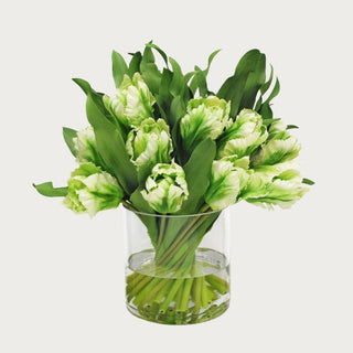 Two-tone green tulip faux floral arrangement with realistic faux water in a clear glass vase, perfect for spring home décor and effortless styling with a polished, modern look.