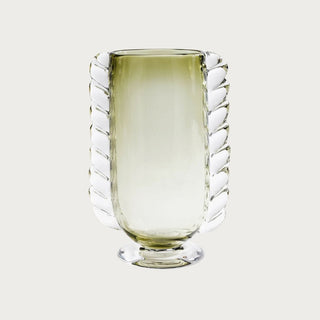 Green braided glass vase with sculptural twisted detailing and soft translucent finish, styled as an elegant decorative accent