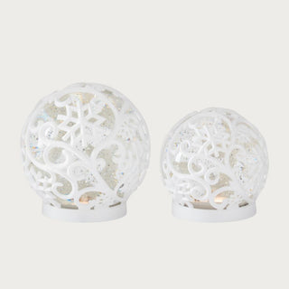 White scrolled snowflake LED water globes with swirling glitter effect — elegant holiday décor set available in large and small sizes by Third & Main.