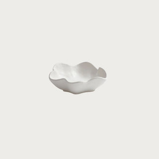 white wavy ceramic condiment bowl with organic edges styled for charcuterie entertaining and kitchen serving