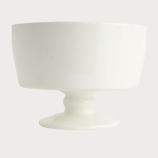 Creamy white ceramic decorative footed bowl with smooth finish and sculptural pedestal base