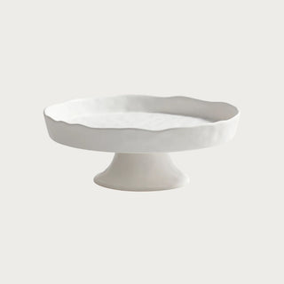 white ceramic footed serving tray with organic waved edge for entertaining fruit display and kitchen island styling
