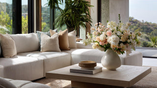 Example of a curated home decor collection by Third & Main with lifelike faux florals, neutral color palette, and thoughtfully layered decor for a cohesive living space.