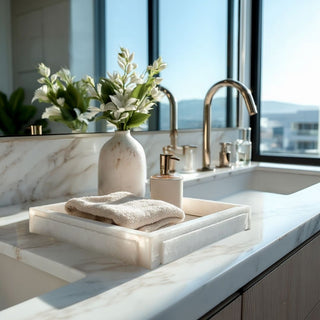 8.5 inch Alabaster Marble Tray styled on a bathroom vanity counter in a contemporary luxury bathroom
