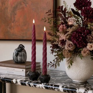 Styled set of two 9.75 inch Bordeaux Twist LED taper candles in deep burgundy wax with spiral detailing and flameless warm light for dining tables, mantels, fall and holiday decor.