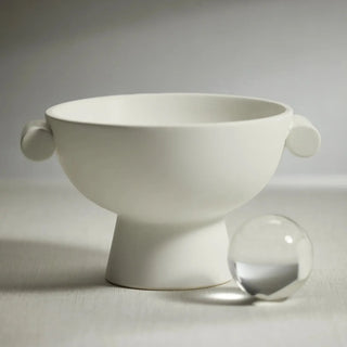 Close-up of the Brea matte white ceramic bowl's footed base and handle detail