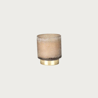Cortina Small Candle, Tobacco Flower, in a taupe and gold glass jar, front studio view
