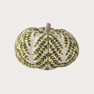 6.75-inch cream knit pumpkin with olive green botanical foliage pattern and natural mango wood stem for seasonal table and console decor.