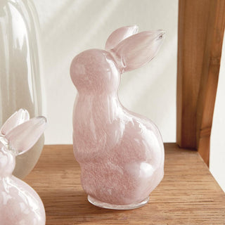The Daisy Mae pink glass bunny sculpture, large size, styled on coffee table