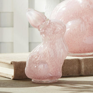 The Daisy Mae pink glass bunny sculpture, small size, styled on side table