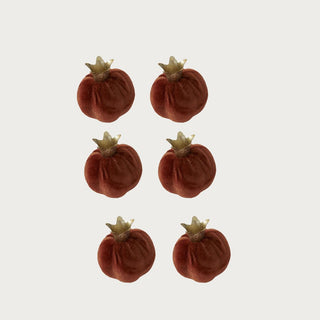 Set of six 2.25-inch dark orange velvet pomegranate bowl fillers with warm metallic crown tops for fall trays, bowls, and seasonal decor.