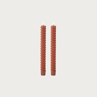 Set of two 9.75 inch rust spiral LED taper candles with twisted wax exteriors, flameless light and 6-hour timers for tabletop and fall home decor.