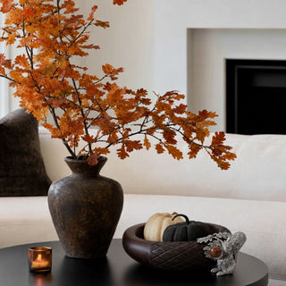 Hartwell wood and pewter squirrel nut bowl styled on a console with fall florals, showing the sculpted pewter squirrel, oak leaf and acorn trim against dark carved wood.