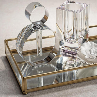 Close-up detail of the large crystal glass perfume bottle's twist top and facets