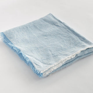 Light blue European linen throw blanket, corner and hem detail