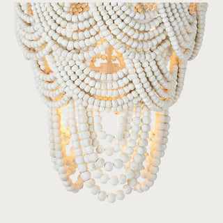 Lorelei wood bead chandelier styled in a living room setting