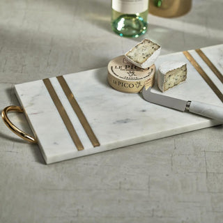 Close-up of brass handle and inlay detail on marble serving tray