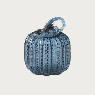 Medium blue speckled handblown glass pumpkin measuring 7.5 inches high with translucent ribbed blue glass, dark speckles, and a sculptural loop stem.