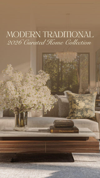 Modern traditional living room featuring a tailored neutral sectional sofa, classic accent pillows, a wood coffee table with stacked books, soft floral arrangement, and an elegant interior that blends timeless design with modern refinement