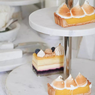 Close-up of mother of pearl inlay and marble tiers on the two tier stand