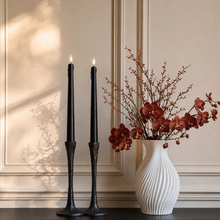 Styled set of two 11.5 inch black Nocturne Drip LED taper candles with realistic wax-drip detailing and flameless light for dining tables, mantels, fall and Halloween decor.