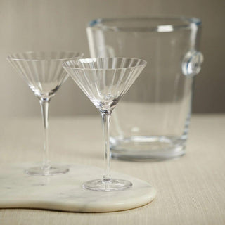 Set of 4 optic-cut clear martini glasses grouped together showing the vertical ridge texture in the glass