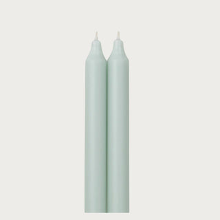 Close-up of pistachio colored taper candle wax finish