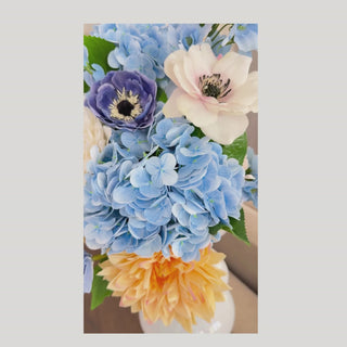 A video of the Azure Garden Summer Premade Floral arrangement- vase not included. A summer modern farmhouse appropriate mix of blue, yellow, white and light pink blooms