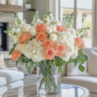 Custom_Premade_Poetry_Petals_Roses_Hydrangea_and_Delphinium_True_Bloom_Real_Touch_Floral_Arrangement with beautiful woman walking up to it and gently arranging some of the florals 