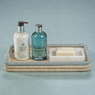 Rectangular alabaster soap dish shown from underneath, highlighting the clear anti-slip bumpers